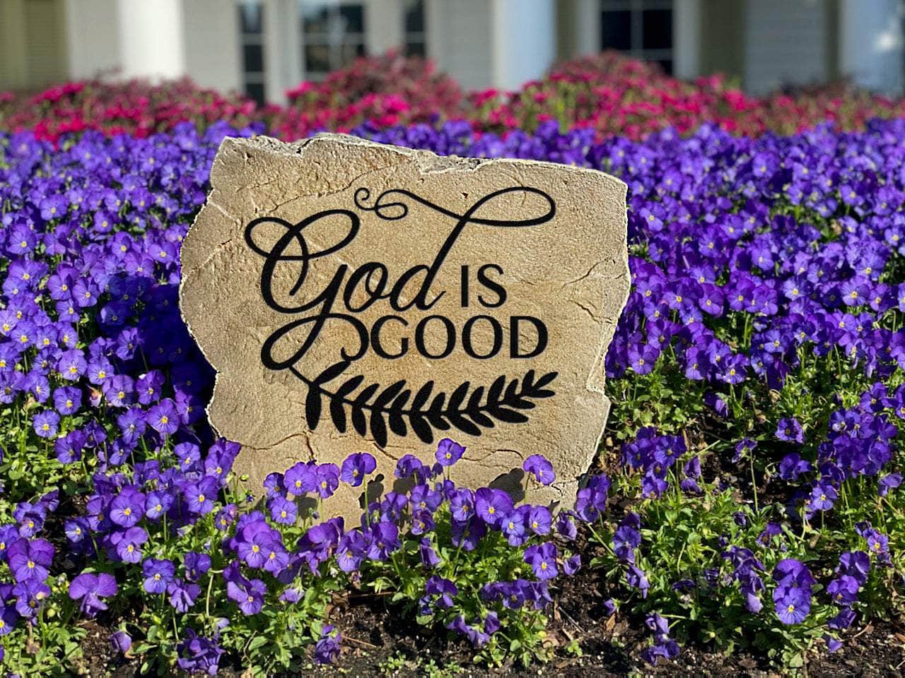 Rustic faith-based rock engraved with God Is Good for landscaping