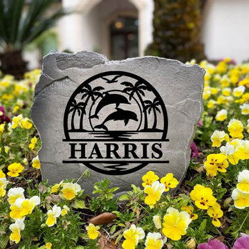 Decorative Dolphin Palms Monogram Stone featuring graceful dolphin accents, palm trees, and a personalized monogram permanently engraved into the stone surface. Perfect for beach homes, patios, and gardens, this outdoor accent adds timeless coastal appeal.