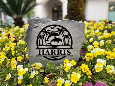 Personalized coastal rock with palm trees and ocean theme, perfect for outdoor décor.