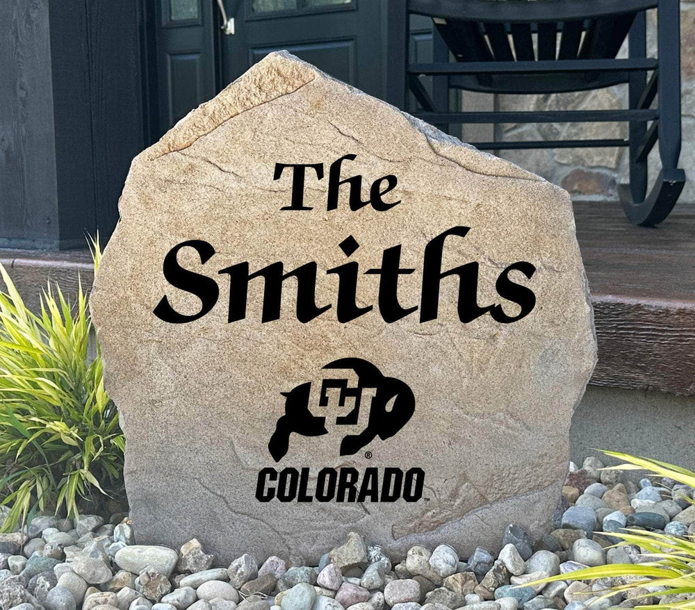 Officially licensed University of Colorado Name Stone featuring a personalized family name and the iconic Colorado Buffaloes logo engraved directly into the stone surface. This custom garden stone adds school pride and curb appeal to front yards, patios, gardens, and entryways.