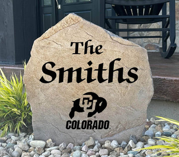 Officially licensed University of Colorado Name Stone featuring a personalized family name and the iconic Colorado Buffaloes logo engraved directly into the stone surface. This custom garden stone adds school pride and curb appeal to front yards, patios, gardens, and entryways.