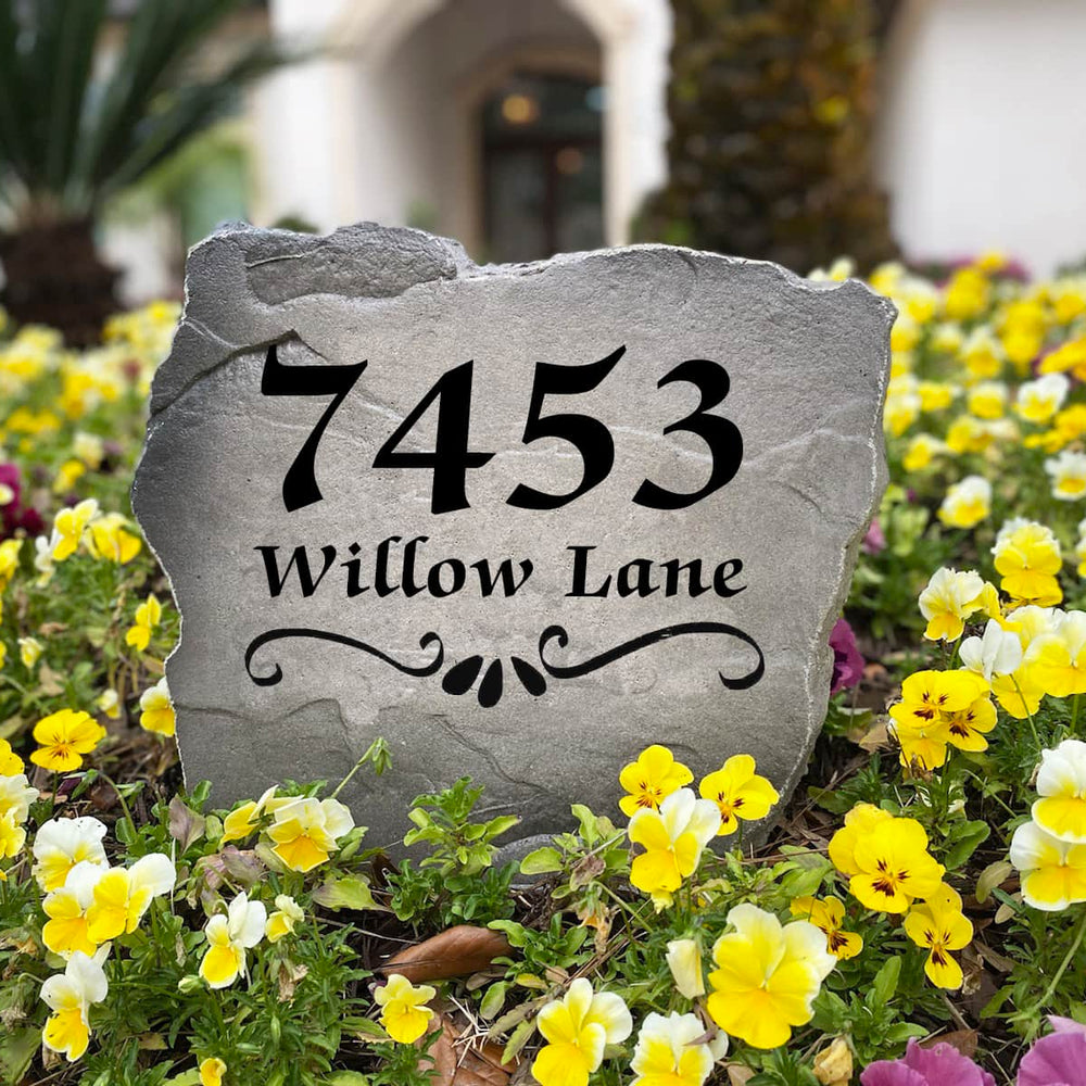 Decorative Scroll Address Stone featuring custom house numbers permanently engraved into the stone surface. Designed for outdoor durability, this personalized address sign creates a stunning focal point for gardens, driveways, and entryways.