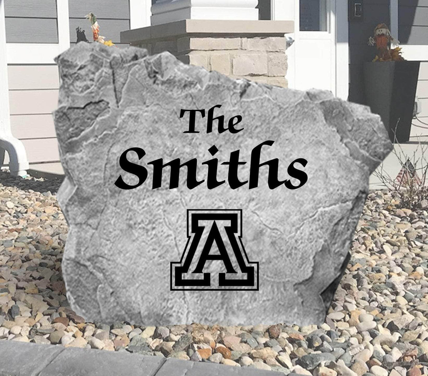 Outdoor decorative rock featuring family name and Arizona Wildcats emblem
