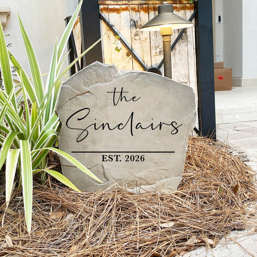 Contemporary family name stone featuring custom engraving carved directly into the stone surface. Perfect for entryways, patios, gardens, and front yards, this modern outdoor sign adds timeless curb appeal to any home.