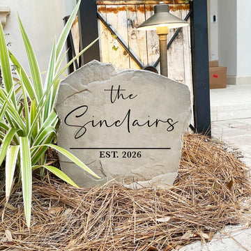 Contemporary family name stone featuring custom engraving carved directly into the stone surface. Perfect for entryways, patios, gardens, and front yards, this modern outdoor sign adds timeless curb appeal to any home.