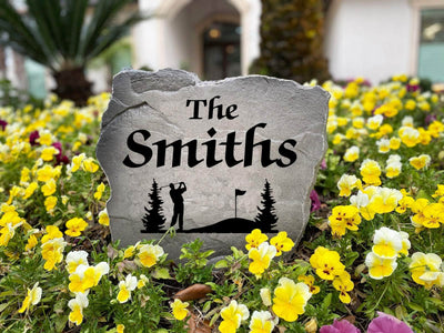 Custom golf-inspired stone decoration with family name engraving.