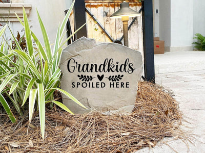 Custom stone featuring grandkids spoiled here message for yard