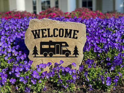 Outdoor landscaping stone with RV camper design and welcome message