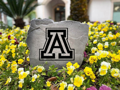 Outdoor stone decoration featuring University of Arizona Wildcats logo