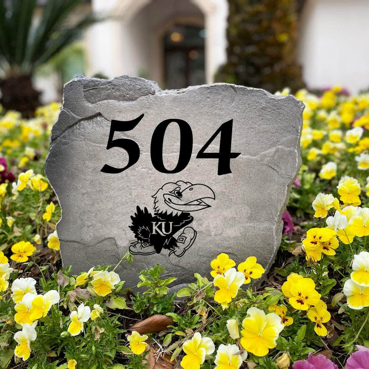 Personalized University of Kansas outdoor address marker engraved into premium stone with authentic Jayhawks graphics. A unique landscaping feature and thoughtful gift for Kansas fans, alumni, and new homeowners.