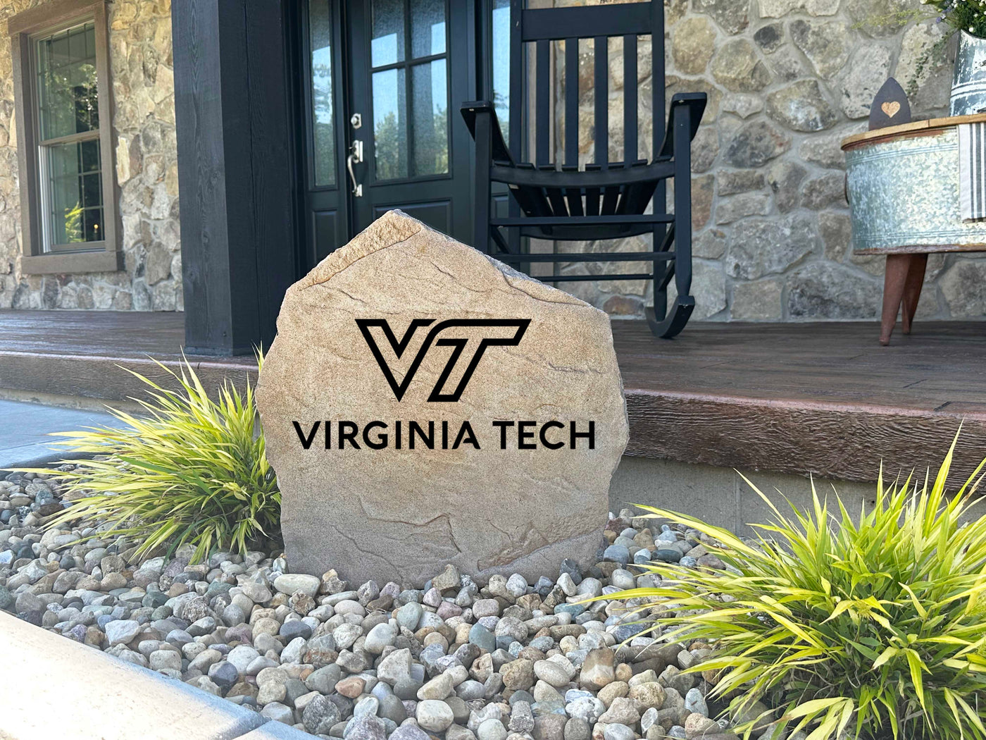 Landscaping rock engraved with Virginia Tech logo