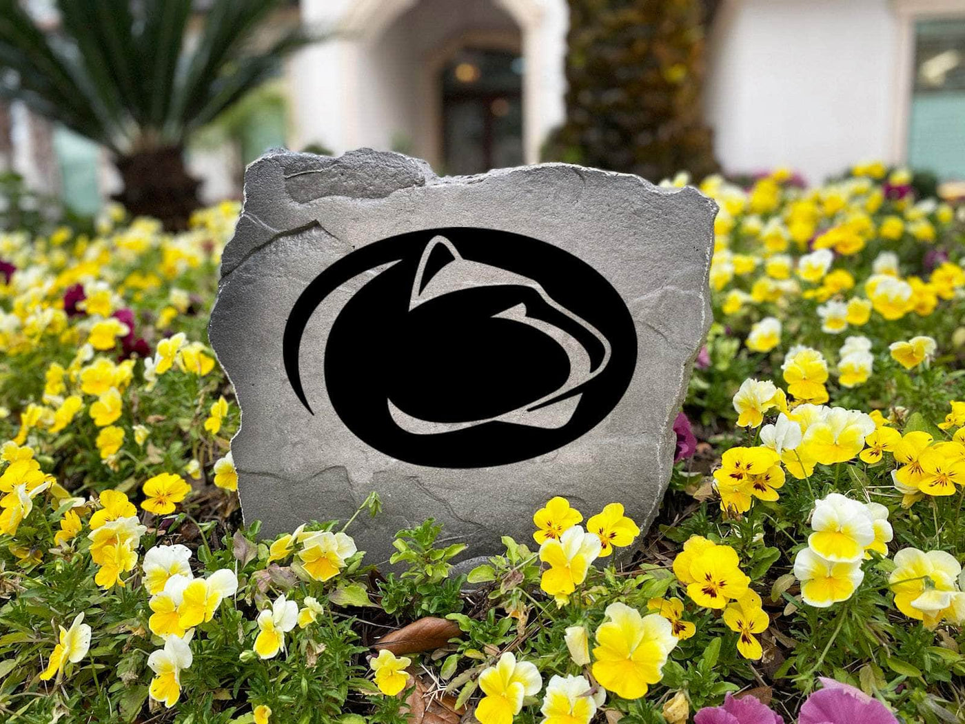 Engraved Penn State University logo on outdoor yard stone