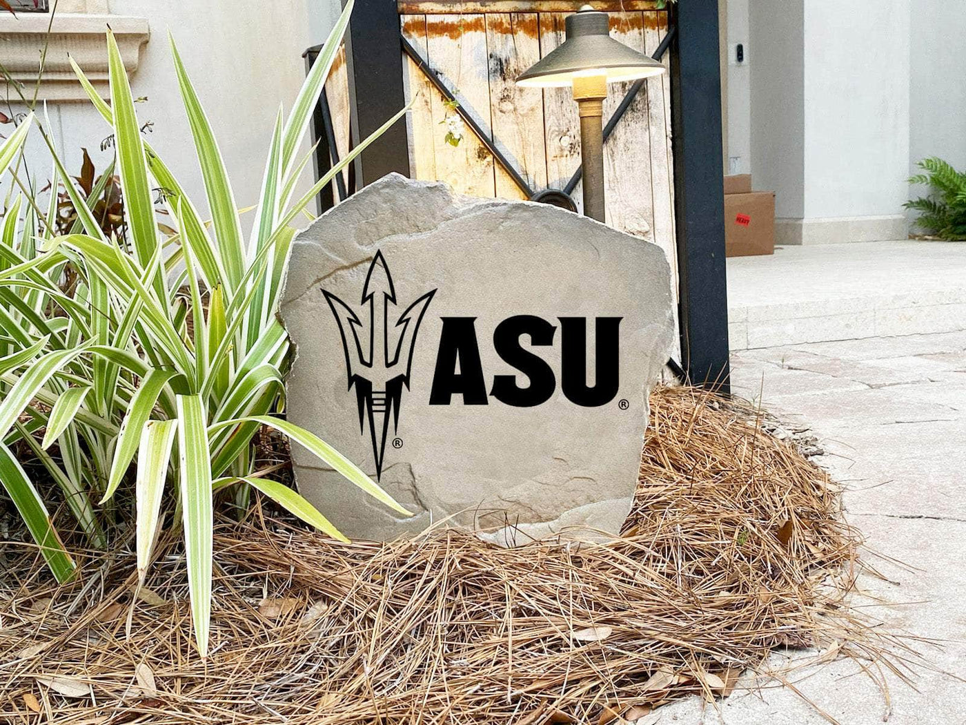 Outdoor stone marker with Arizona State University logo for home landscaping
