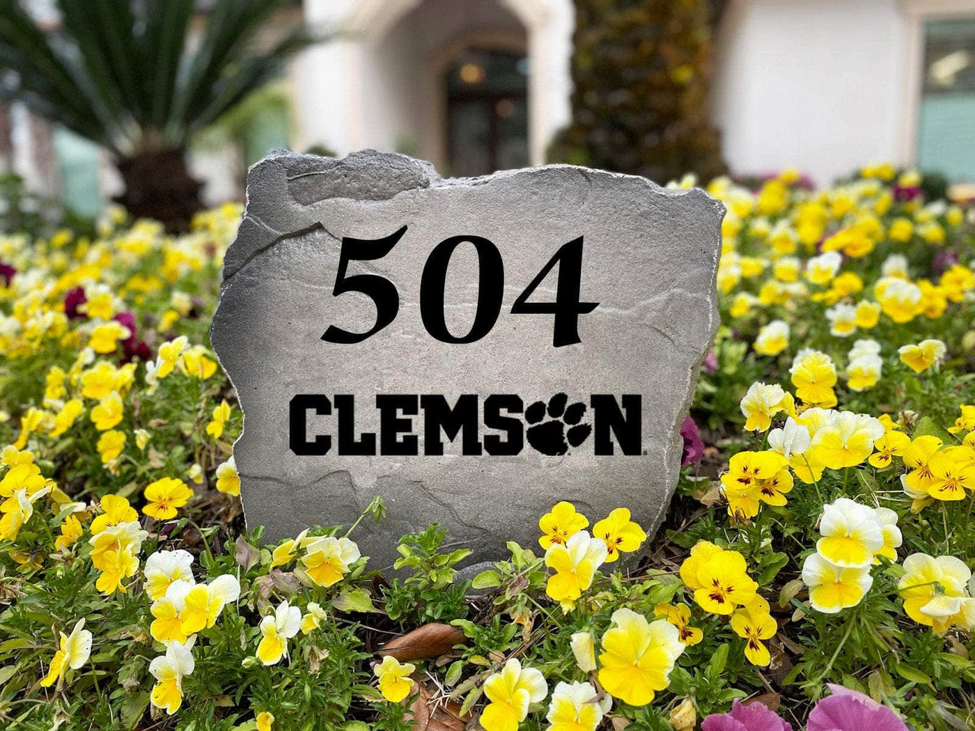 Outdoor address stone featuring Clemson University logo