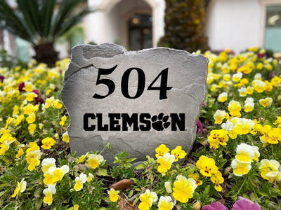 Outdoor address stone featuring Clemson University logo