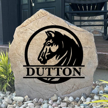 Personalized Horse Monogram Name Stone featuring a custom family name, monogram, and elegant horse design engraved directly into the stone surface. This decorative garden stone adds equestrian charm and curb appeal to front yards, barns, patios, and entryways.