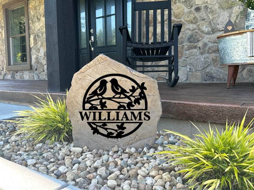 Decorative outdoor love birds monument with custom engraving for family or love-themed garden decor.