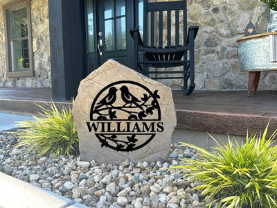 Decorative outdoor love birds monument with custom engraving for family or love-themed garden decor.