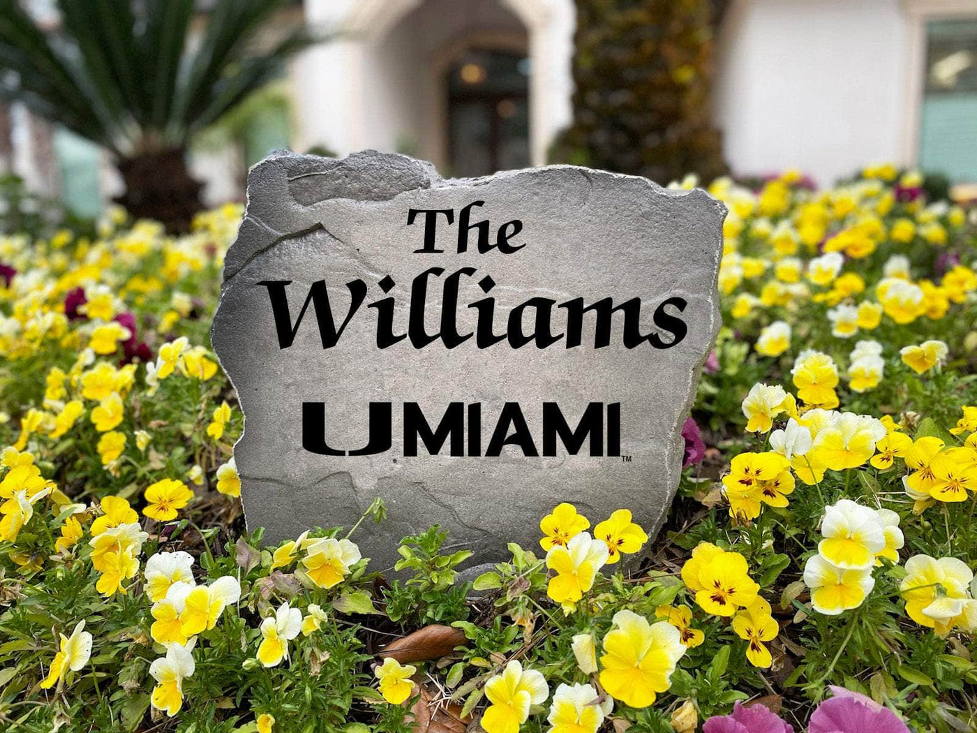 Outdoor yard stone with Miami Hurricanes and family name