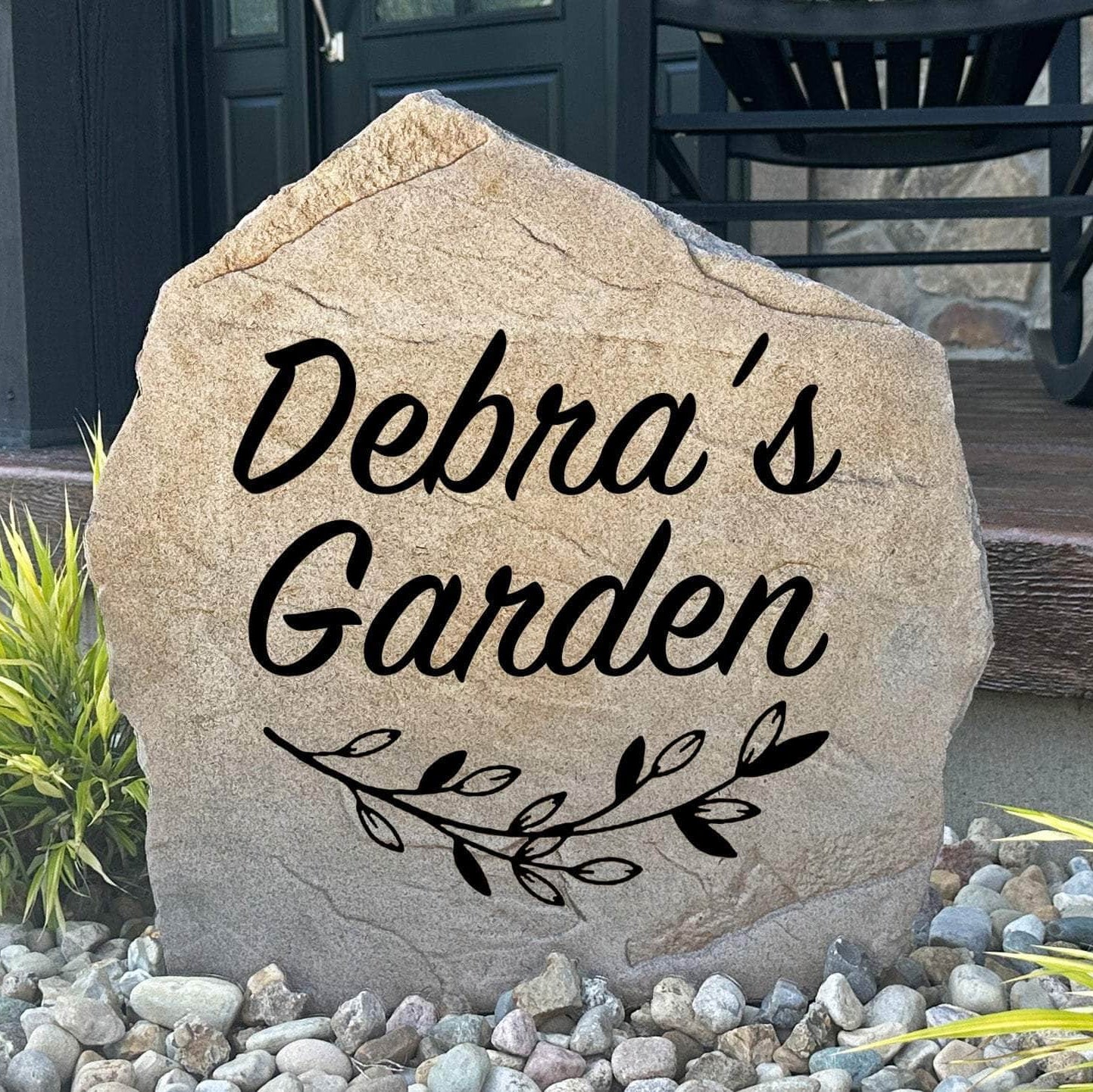 Personalized garden name stone custom engraved with your family name to create a charming focal point among flowers, shrubs, and landscaped beds.