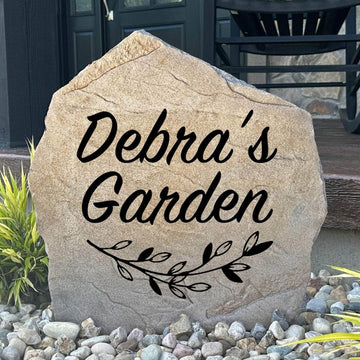 Personalized garden name stone custom engraved with your family name to create a charming focal point among flowers, shrubs, and landscaped beds.