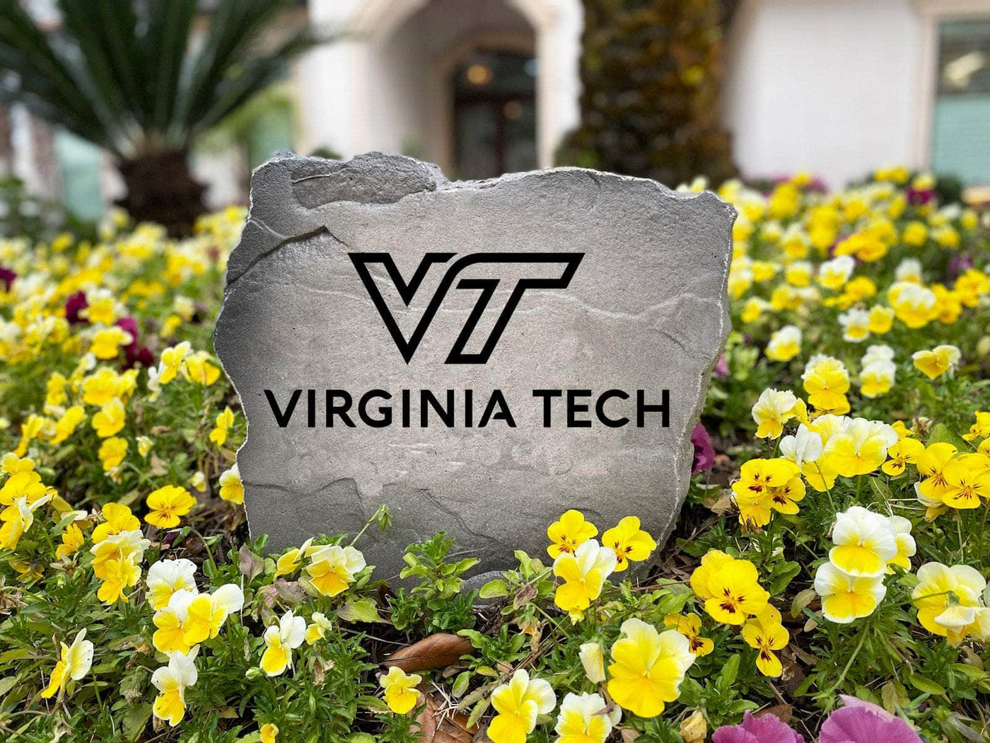 Virginia Tech logo carved into decorative yard stone