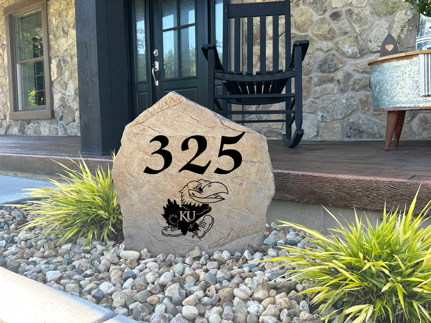 Outdoor stone marker featuring KU Jayhawks logo and custom address