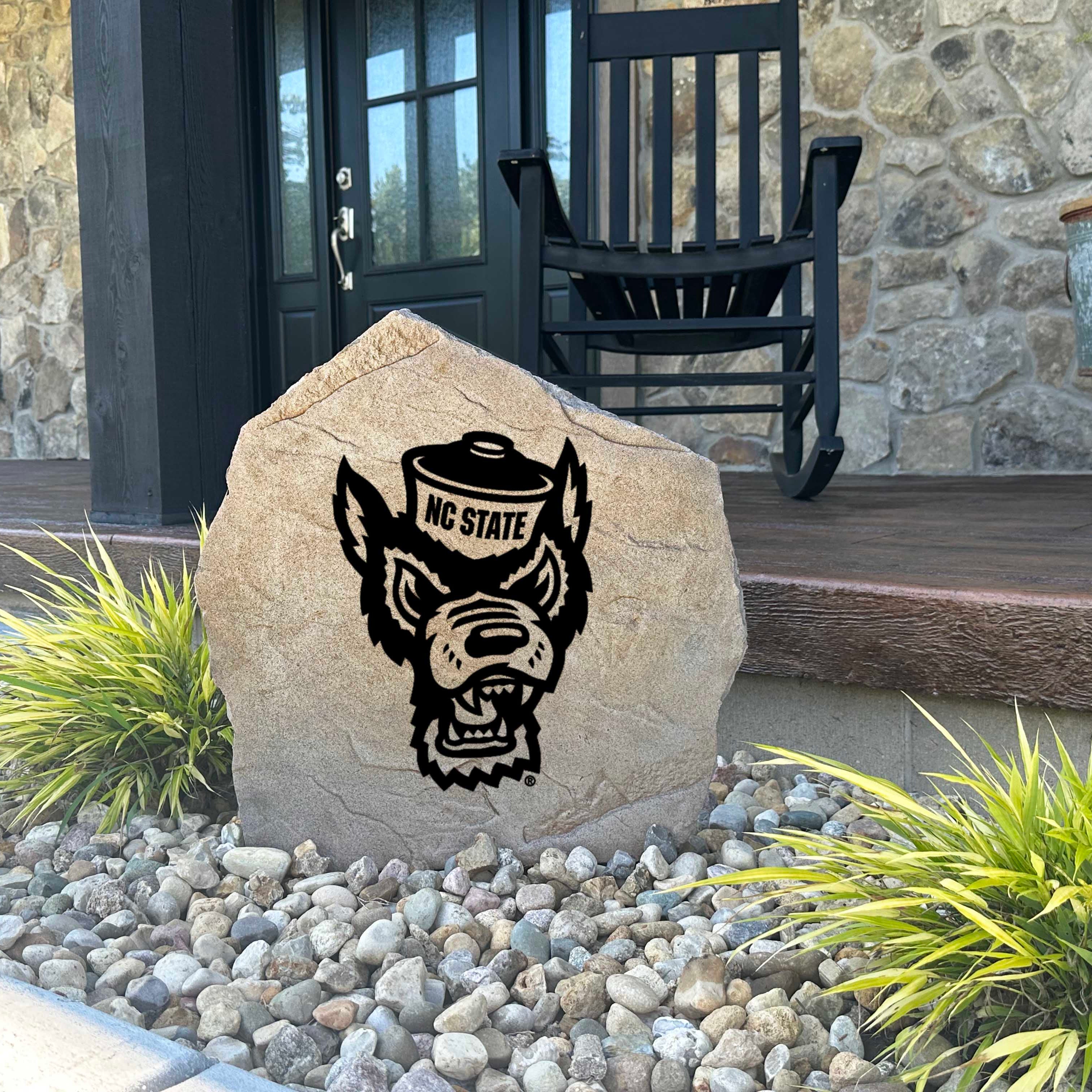 Decorative NC State Wolfpack mascot garden stone featuring the official university logo permanently engraved into durable stone. An eye-catching addition to patios, fan spaces, outdoor kitchens, and landscape borders.
