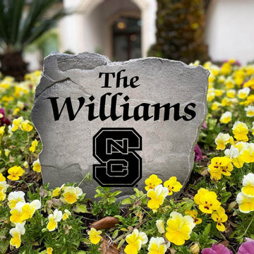 Personalized NC State Wolfpack outdoor name stone featuring custom family lettering permanently engraved into weather-resistant stone. A thoughtful gift for college football fans, alumni, weddings, housewarmings, and new homeowners.