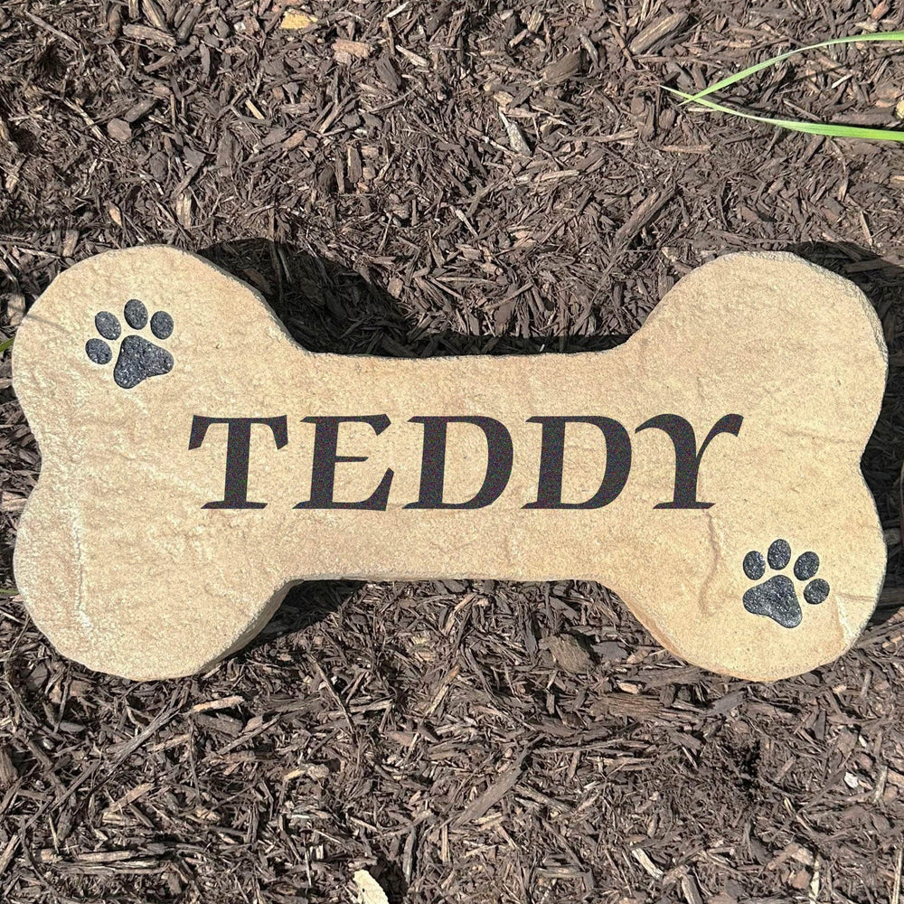 Personalized Dog Bone Stone featuring a classic bone shape and custom engraving, creating a charming accent for pet lovers. This decorative garden stone adds personality and curb appeal to front yards, patios, gardens, and entryways.