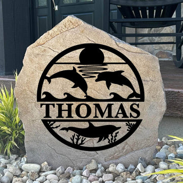 Personalized Dolphin Monogram Stone featuring a custom initial and elegant dolphin design engraved directly into the stone surface. This decorative garden stone adds coastal charm and curb appeal to beach houses, patios, gardens, and entryways.