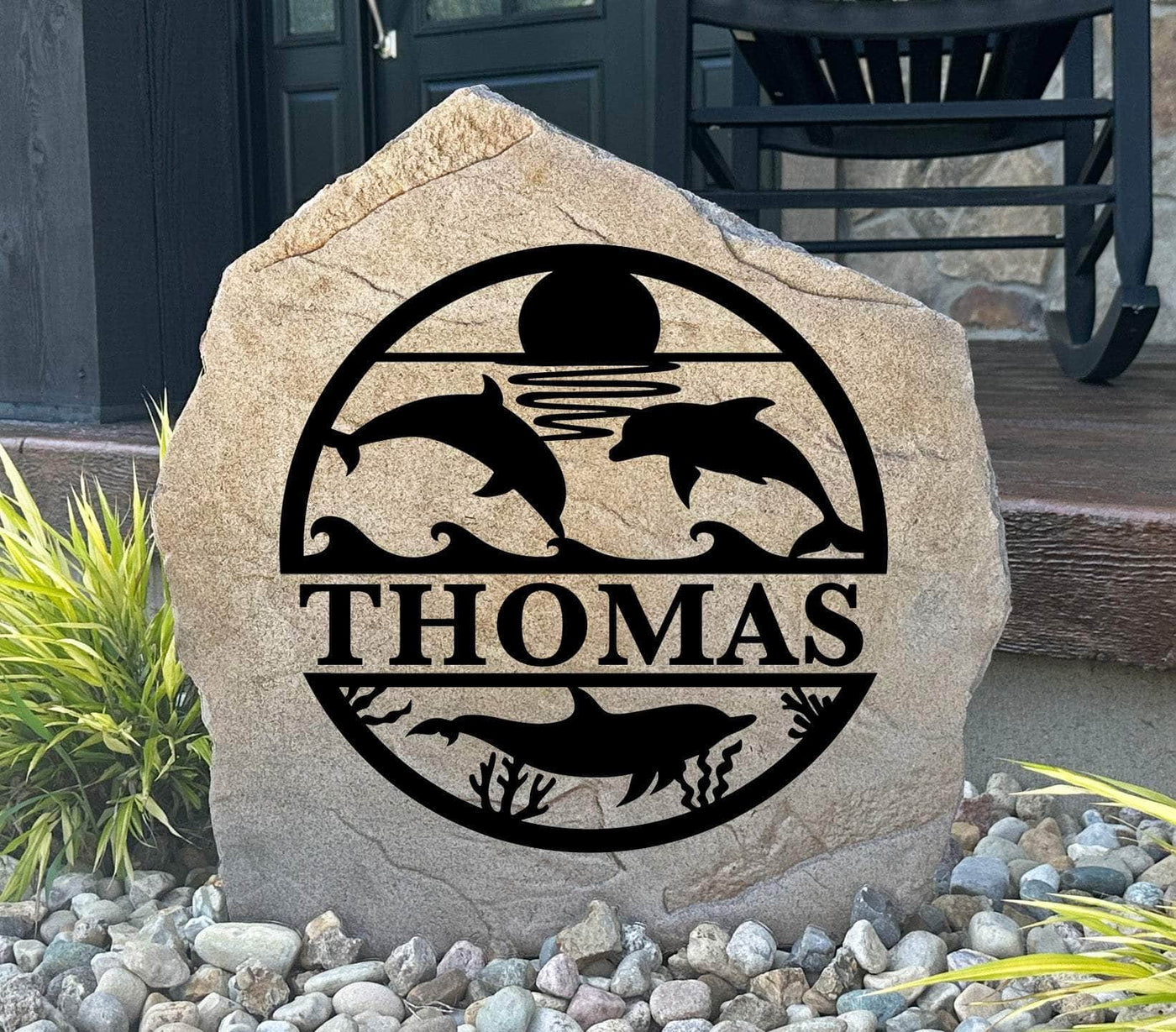 Ocean-themed monogram stone featuring dolphins, waves, and personalized family name.