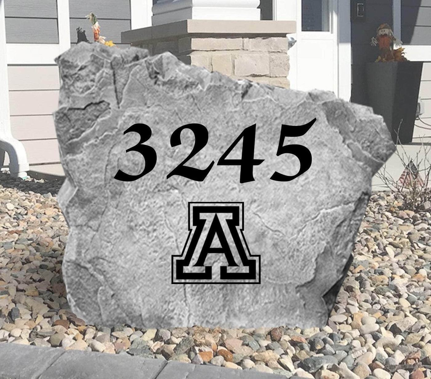 Outdoor decorative rock with house number and Arizona Wildcats emblem