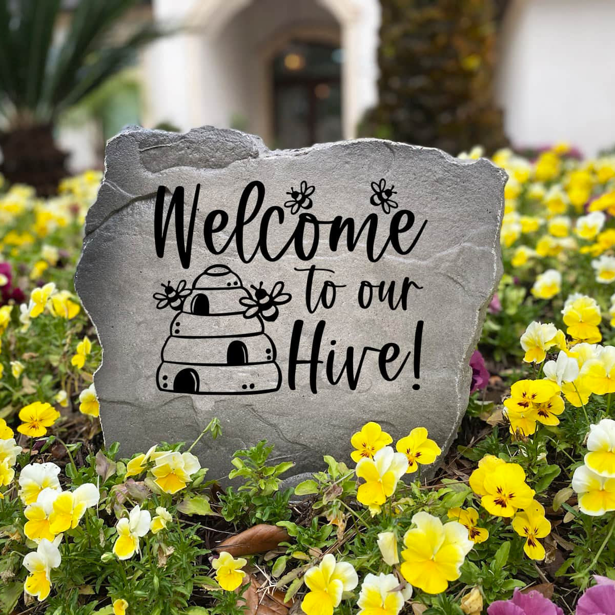 Personalized Welcome Hive Stone handcrafted in the USA and engraved directly into the stone surface. This decorative garden stone celebrates bees and nature while creating an inviting focal point for walkways, patios, and front yard landscapes.