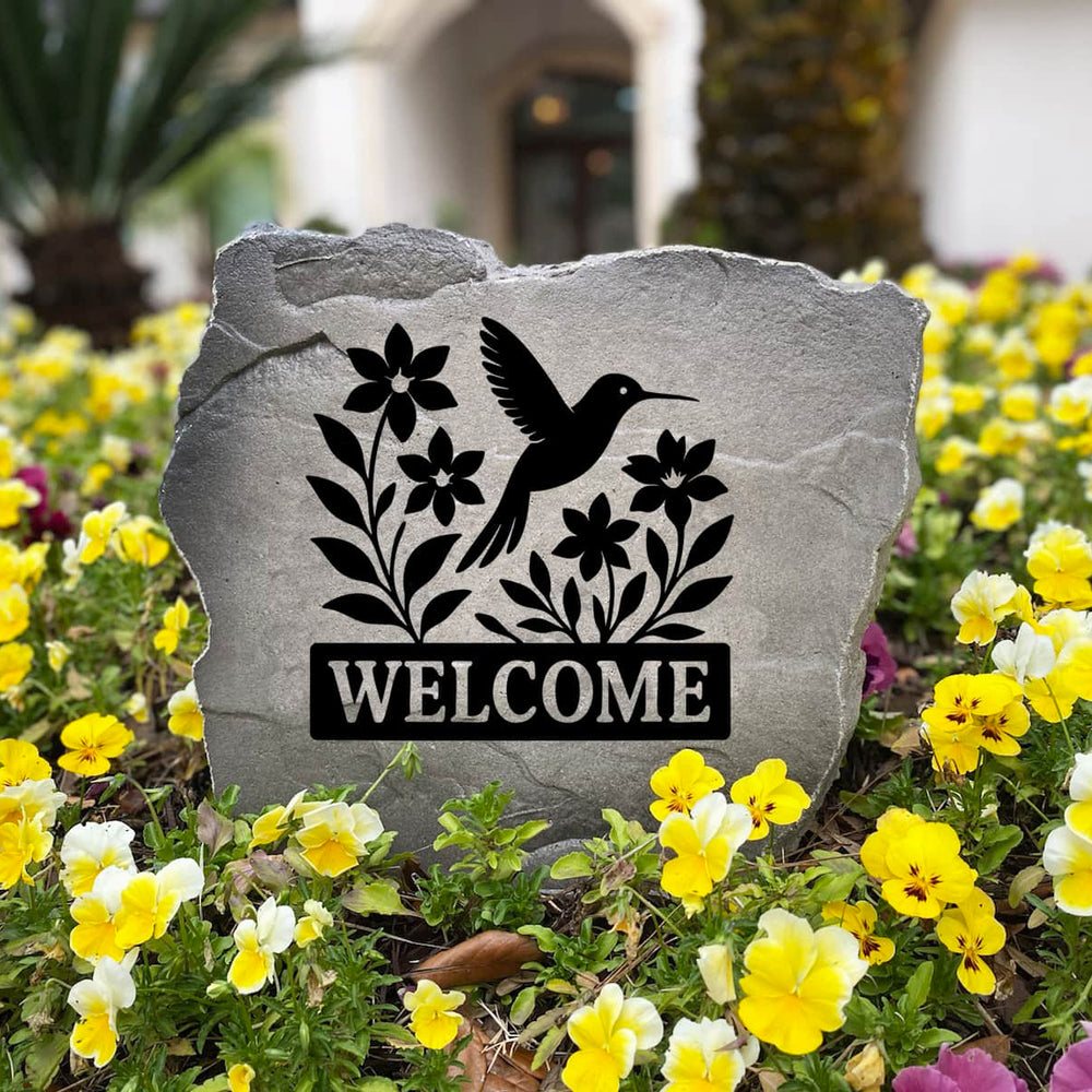Nature-inspired Welcome Hummingbird Stone handcrafted in the USA and engraved directly into the stone surface. This decorative garden stone enhances walkways, entryways, and landscaped flower beds with timeless beauty.