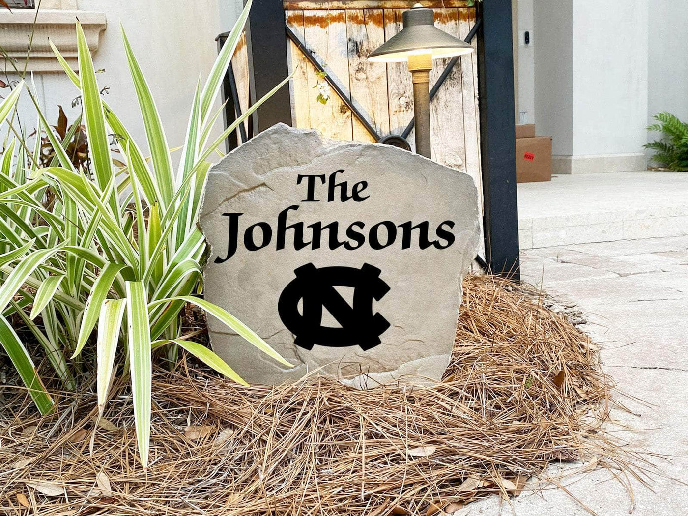 Personalized yard rock with Tar Heels emblem and engraved name