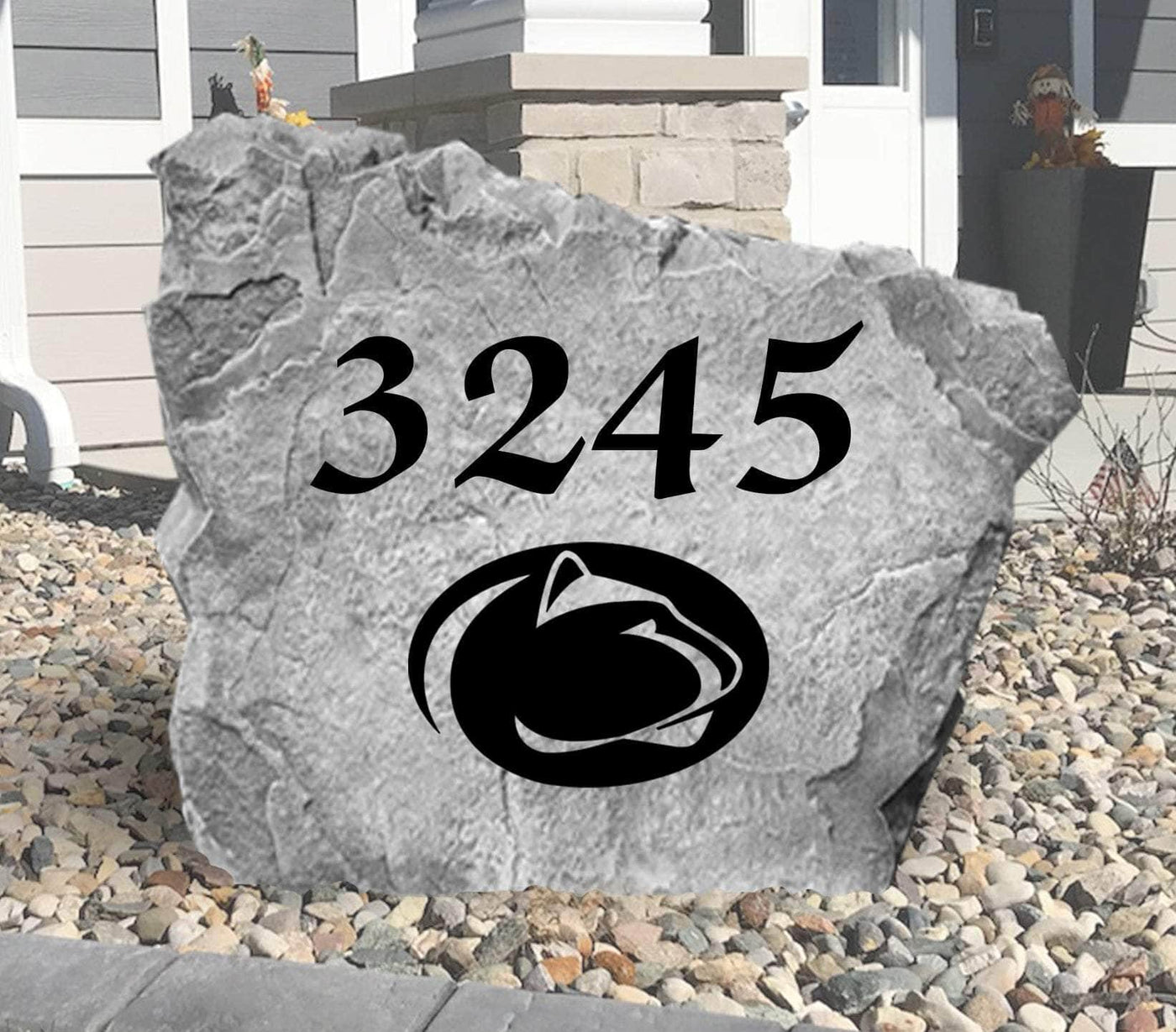Decorative rock featuring house number and Penn State emblem