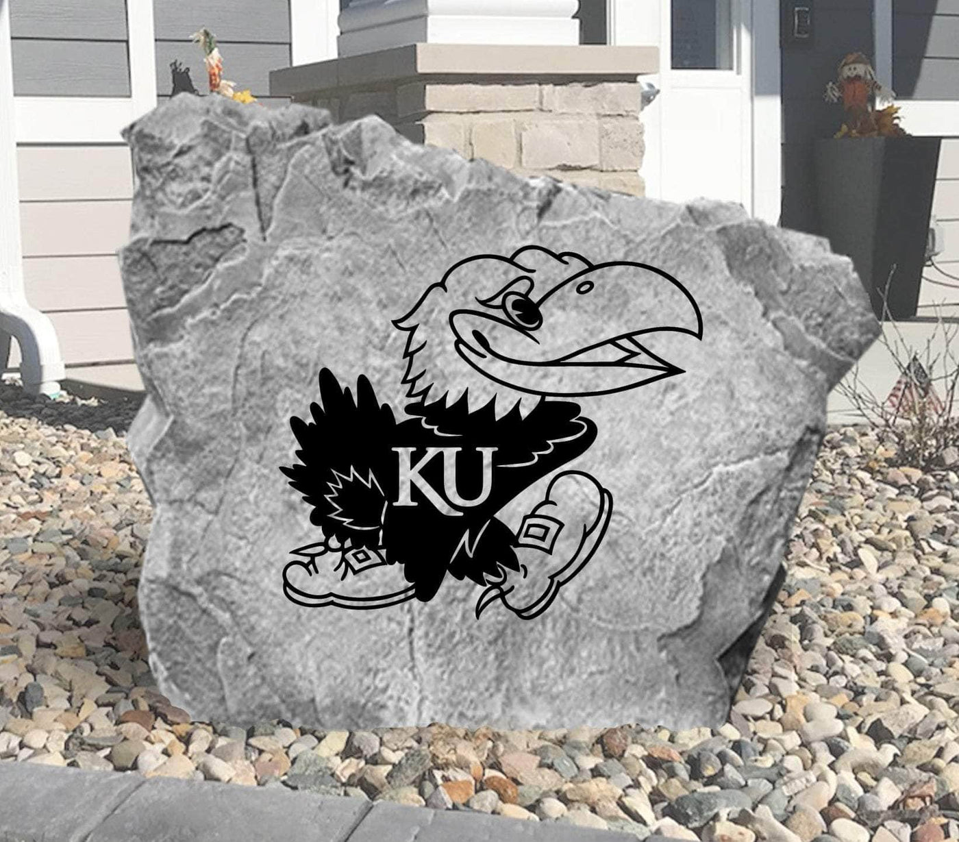 Decorative yard rock featuring KU Jayhawk emblem