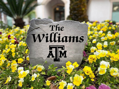 Custom rock featuring the family name and Texas A&M logo