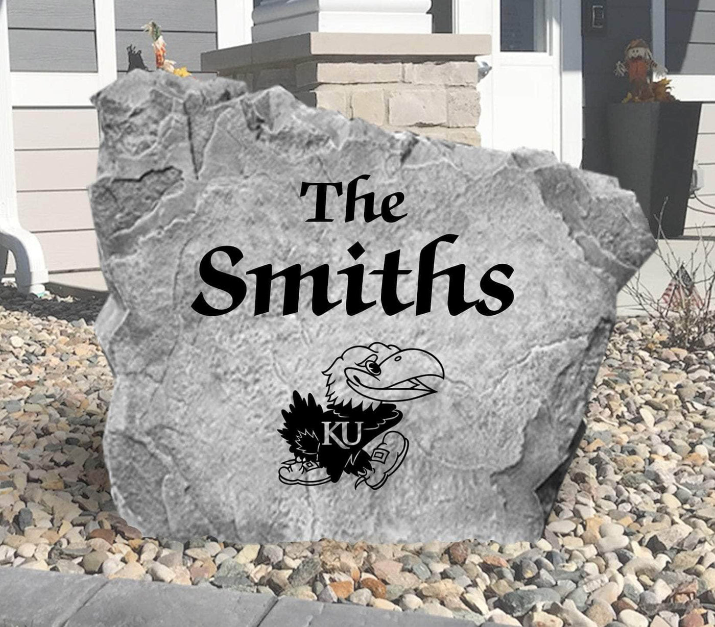 Engraved yard rock with KU Jayhawk emblem and personalized family name