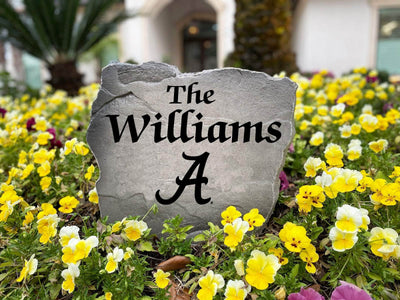 Engraved Alabama Crimson Tide name stone for front yard decor.