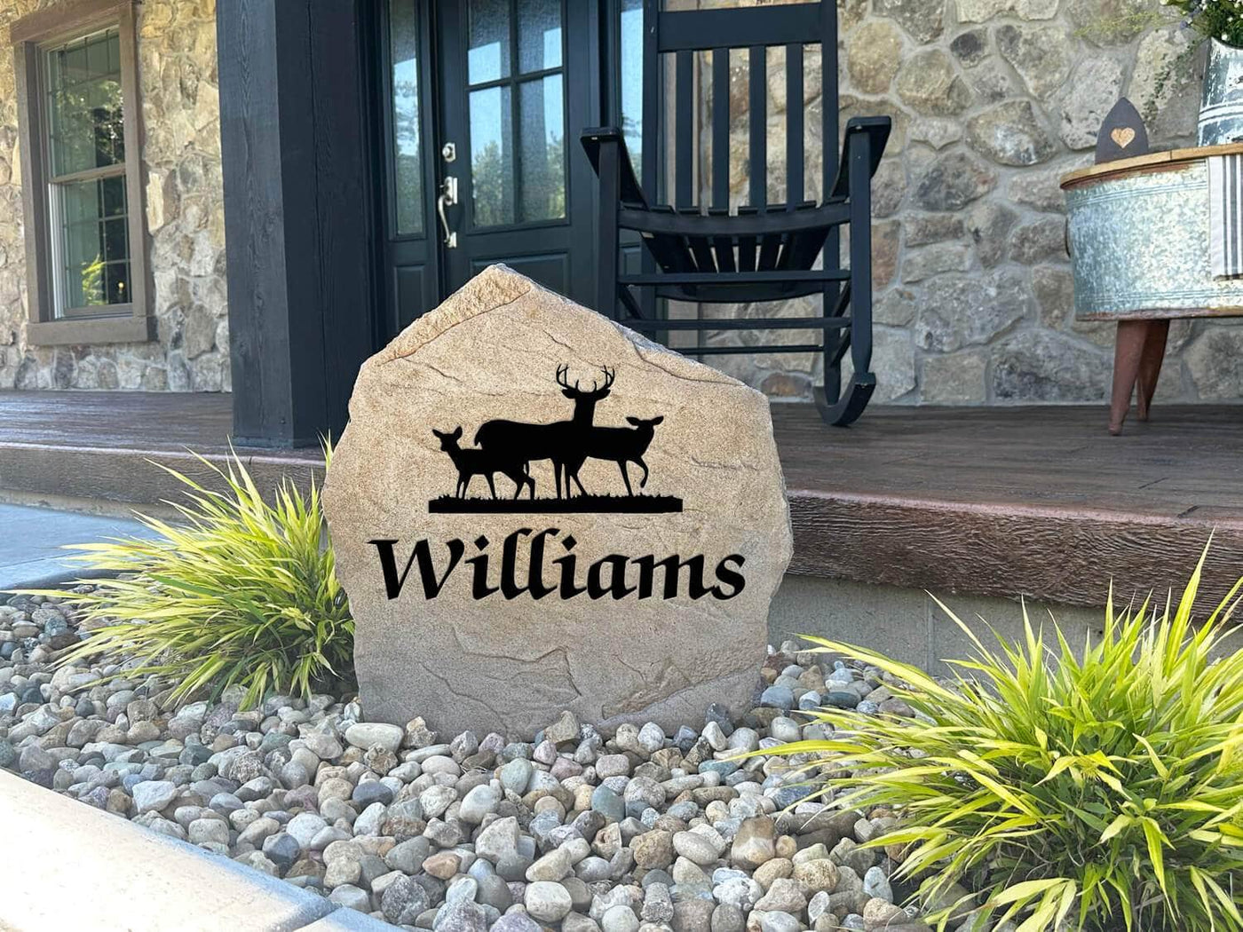 Custom deer rock featuring family name and wildlife design