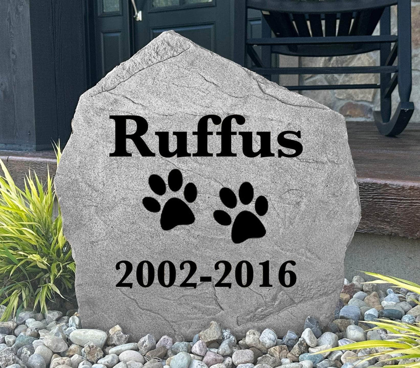 Personalized dog memorial rock with engraved design for outdoor remembrance