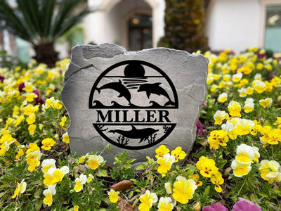 Custom outdoor rock with dolphins and sunset, a great gift for ocean enthusiasts.