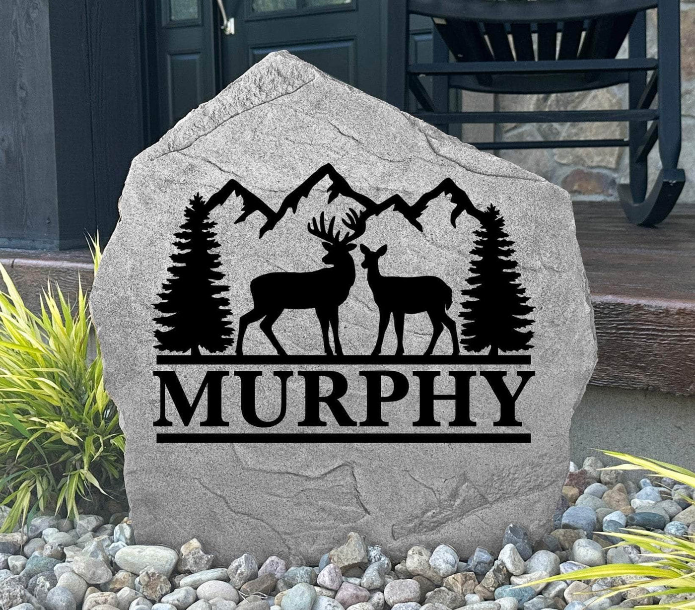 Engraved rock featuring a buck and doe with pine trees, great gift for hunters or nature lovers.