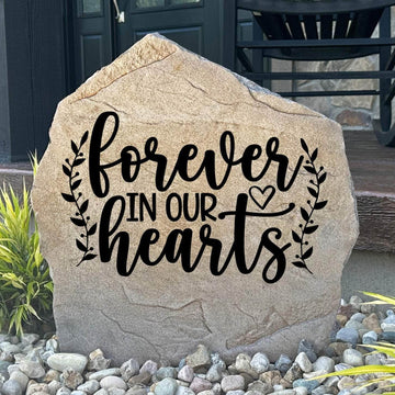 Decorative remembrance garden stone featuring the heartfelt message "Forever In Our Hearts," creating a peaceful place for reflection and healing.