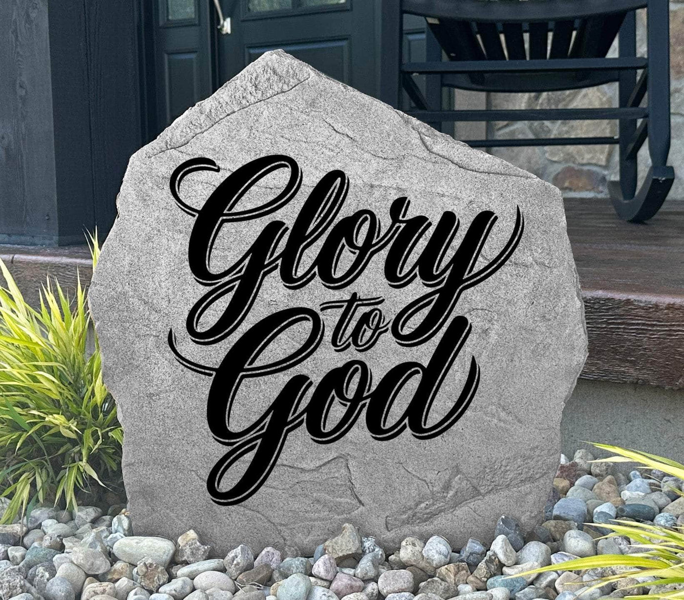 Engraved garden stone featuring Glory To God message.