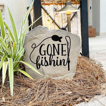 Fishing-themed landscape stone featuring the message "Gone Fishin'," ideal for cabins, ponds, riverfront properties, and backyard retreats.