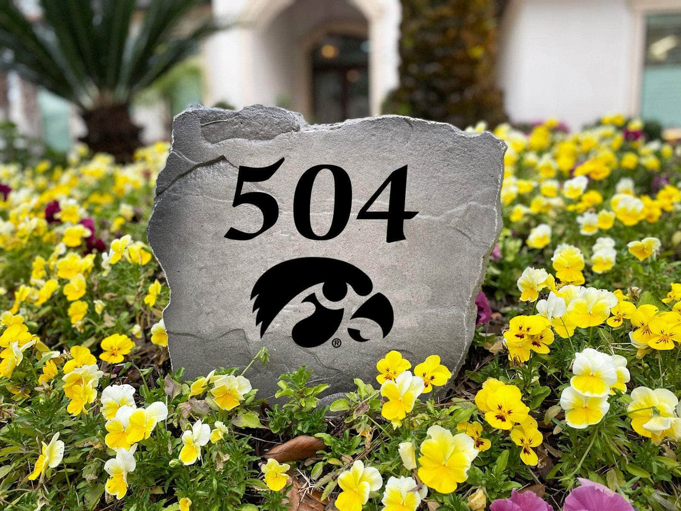 Engraved Iowa stone featuring home address and team logo