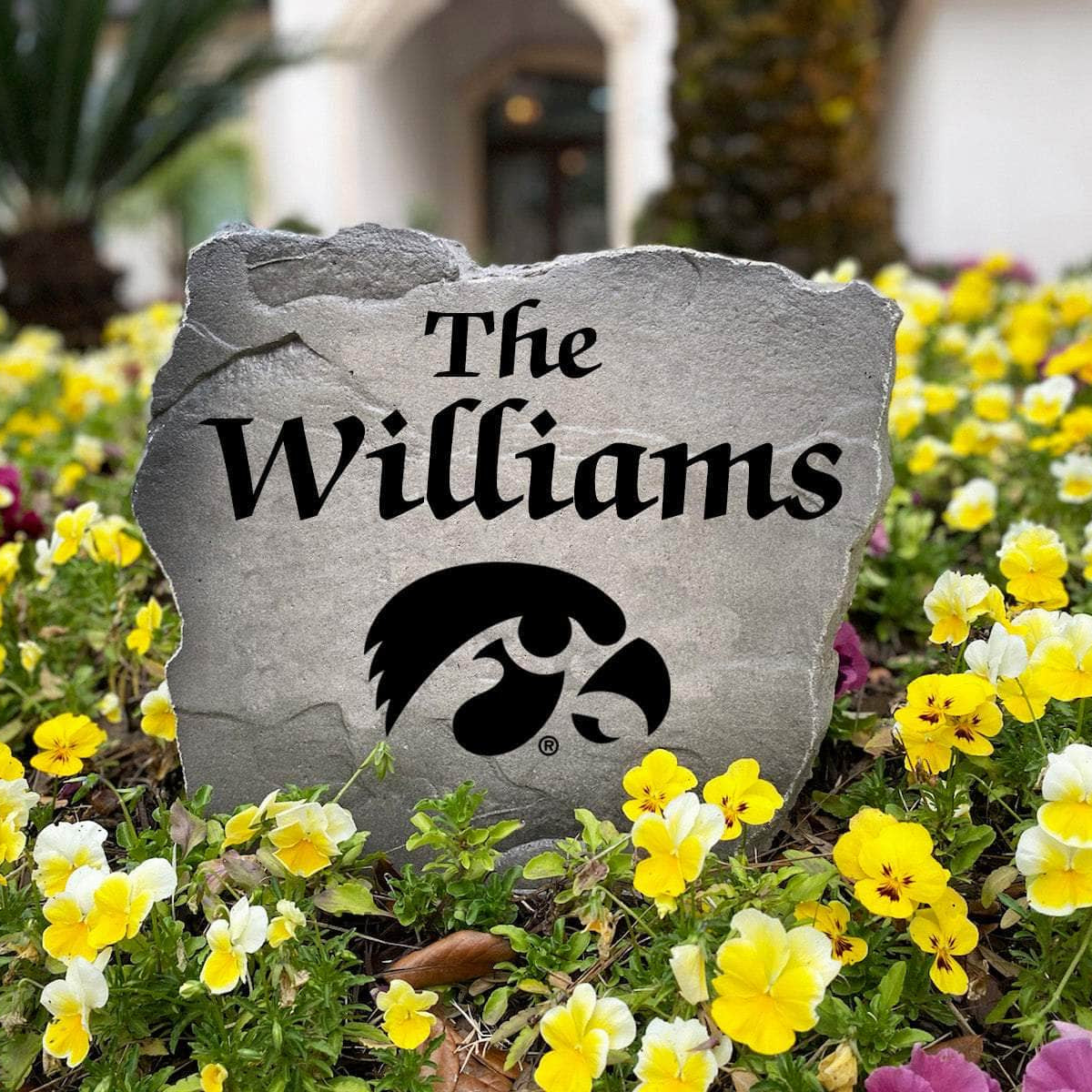 Personalized University of Iowa outdoor name stone featuring custom family lettering permanently engraved into premium stone. A unique gift for Hawkeyes fans, alumni, graduates, housewarmings, and football enthusiasts.